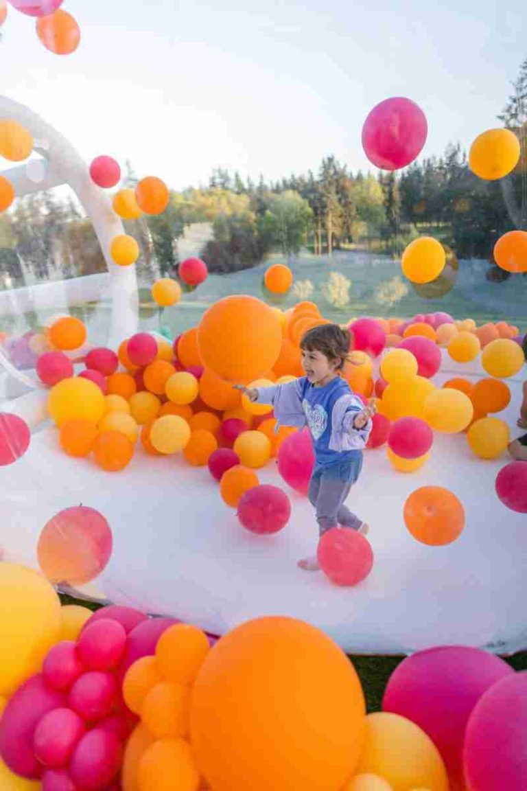 Child playing in a bubble house