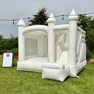 Premium white bounce house with slide for elegant party rentals in Snohomish and King County