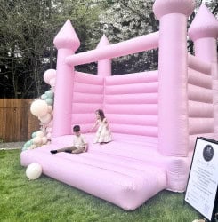 backyard kids party pink bounce house balloon garland Everett 174 9 Pinkalicious