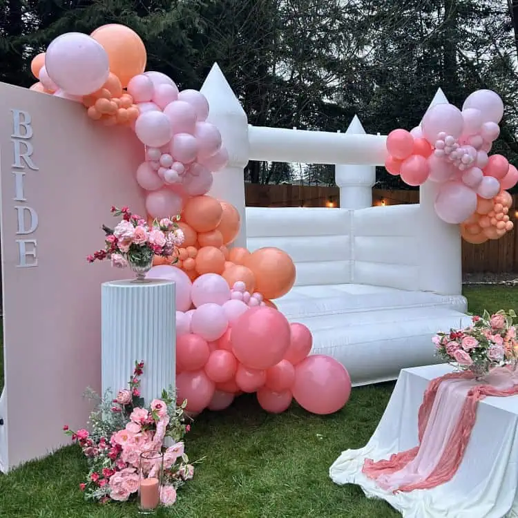 Luxury bounce house rental in arlington and white bounce castle in arlington with white bounce house castle and balloon garland for bridal shower in arlington