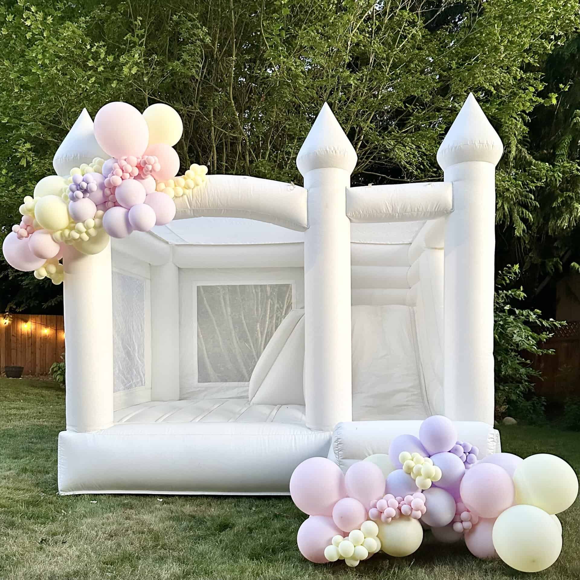 St. Helens combo bouncer - luxury white bounce house for upscale events. Kids bouncing on bounce house for birthday party on our Luxury bounce house rental in Edmonds in Snohomish county and king county. Also seen in white bounce castle in lake stevens.