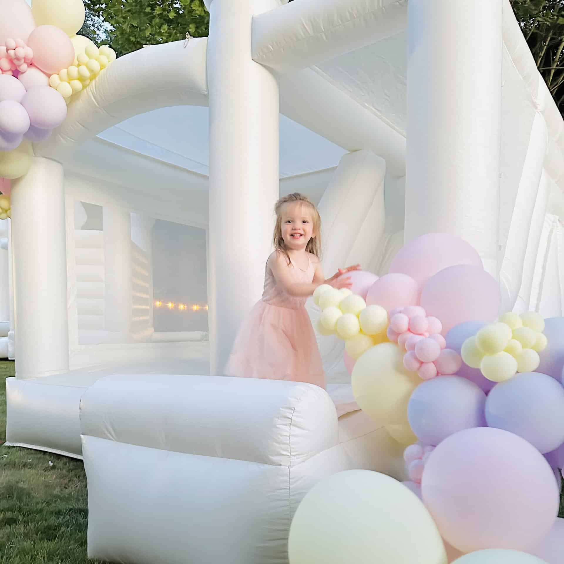 St. Helens combo bouncer - luxury white bounce house for upscale events. Kids bouncing on bounce house for birthday party on our Luxury bounce house rental in Edmonds & white bounce castle in edmonds in Snohomish county and king county.