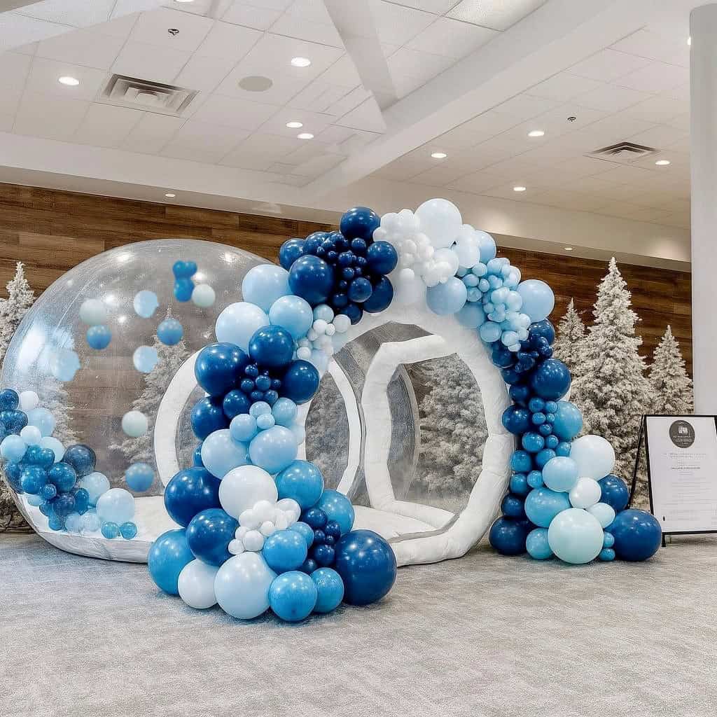 Photo: Winter Wonderland bounce house and bubble house rental styled for an indoor holiday party.