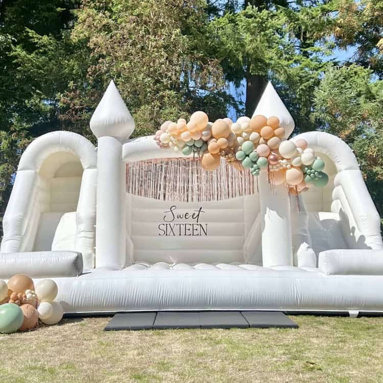 Photo: build your own party decor package around a luxury white bounce house