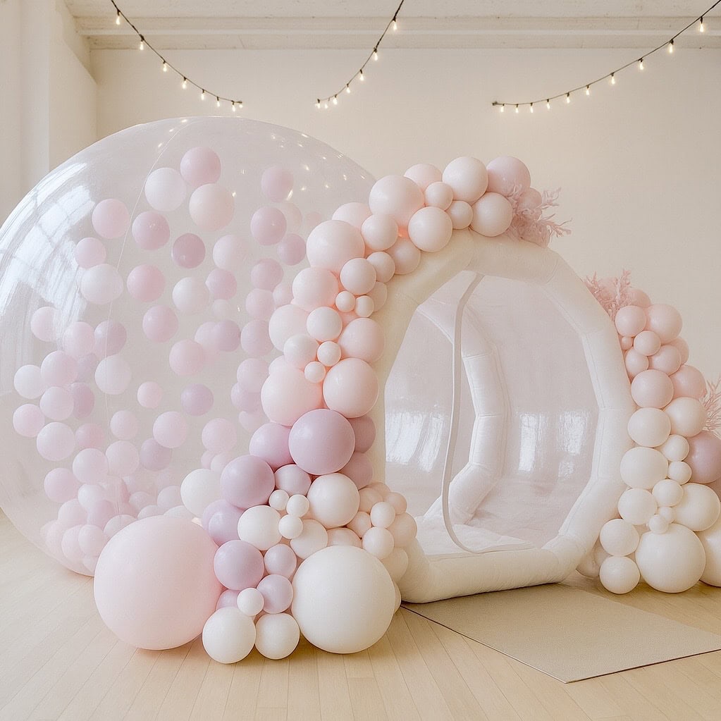 Bubble house styled for a bridal shower with pastel garland framing entrance; premium photo moment.