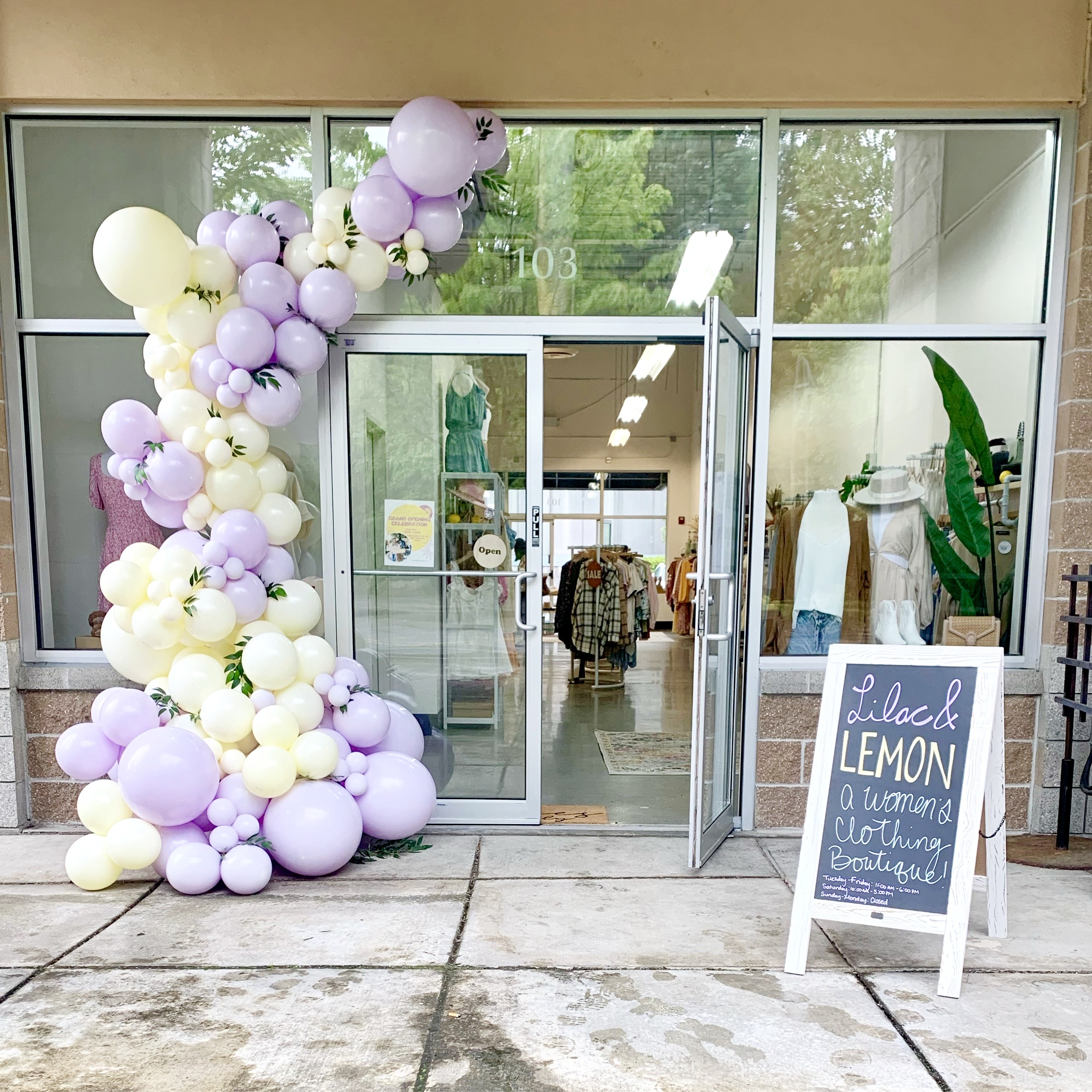 Ivory and lavender balloon garland and custom backdrop at Lilac and Lemon in Bothell, WA