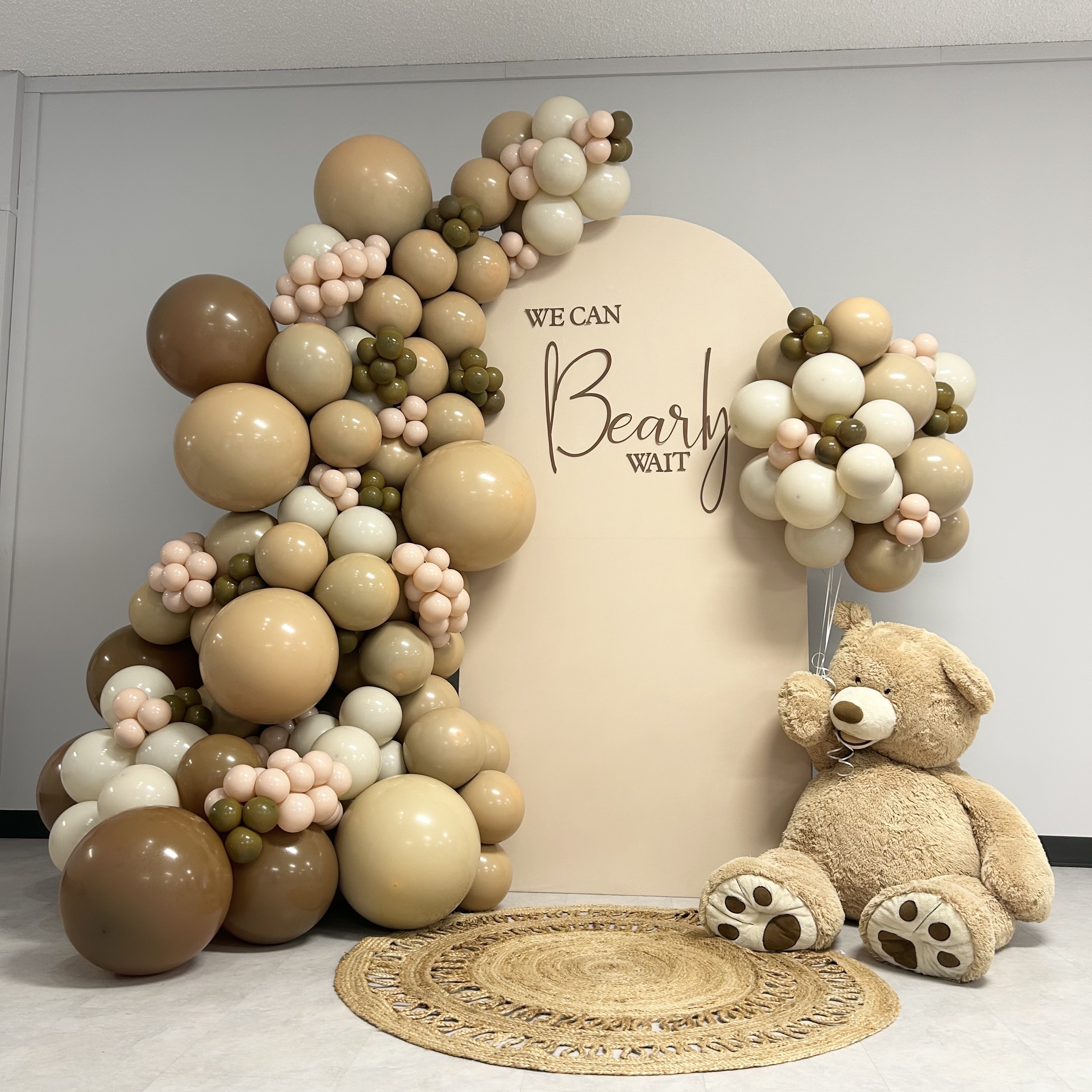 Sand, blush, and sage balloon garland and bear themed backdrop for a baby shower at Meadowdale Preschool in Edmonds, WA