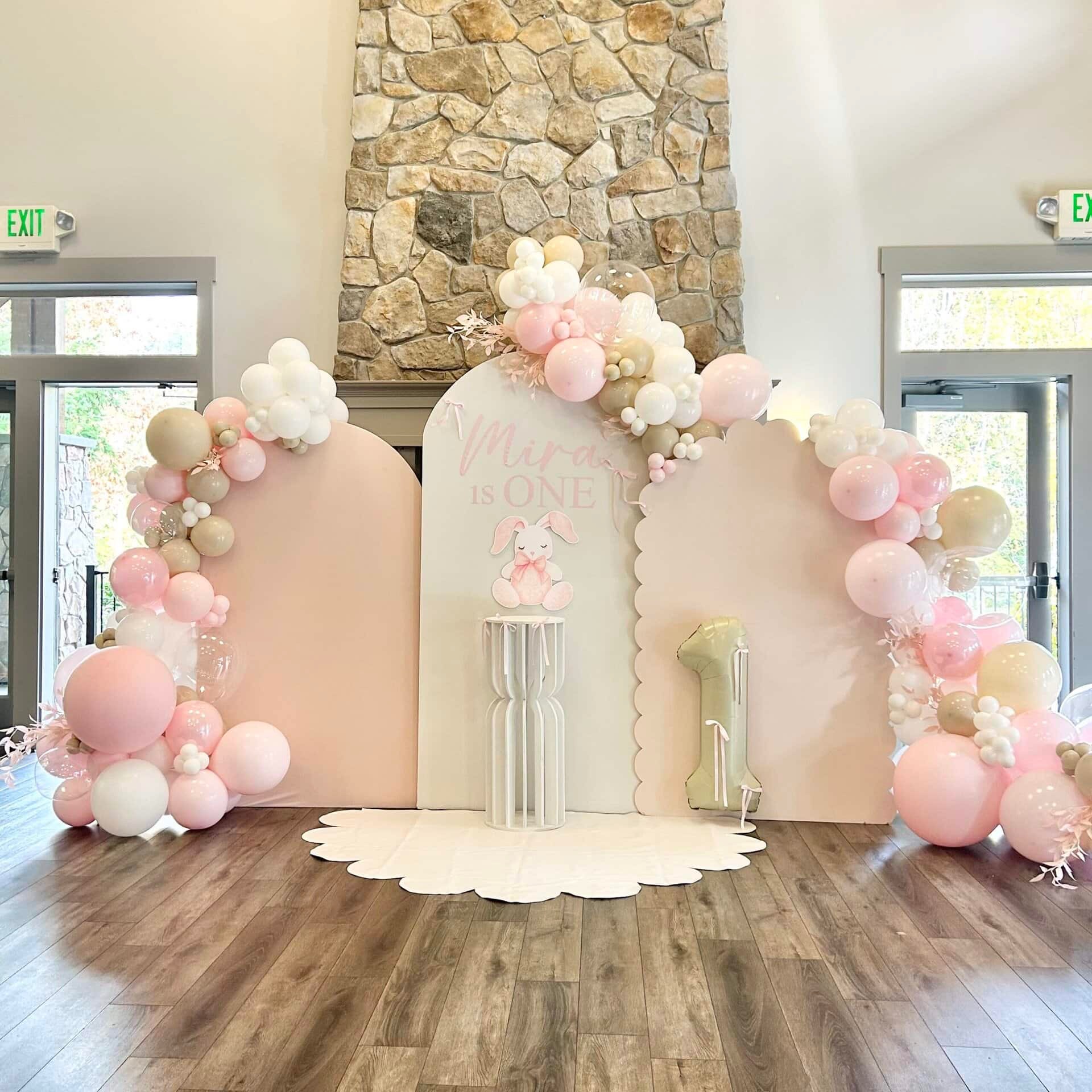 Luxury blush, ivory, and sand organic balloon garland with bunny themed accents for a first birthday backdrop in Monroe, WA