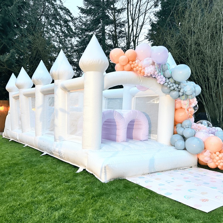 white, peach, and mint balloon garland and custom backdrop styled for a Kids Camp in Monroe, WA