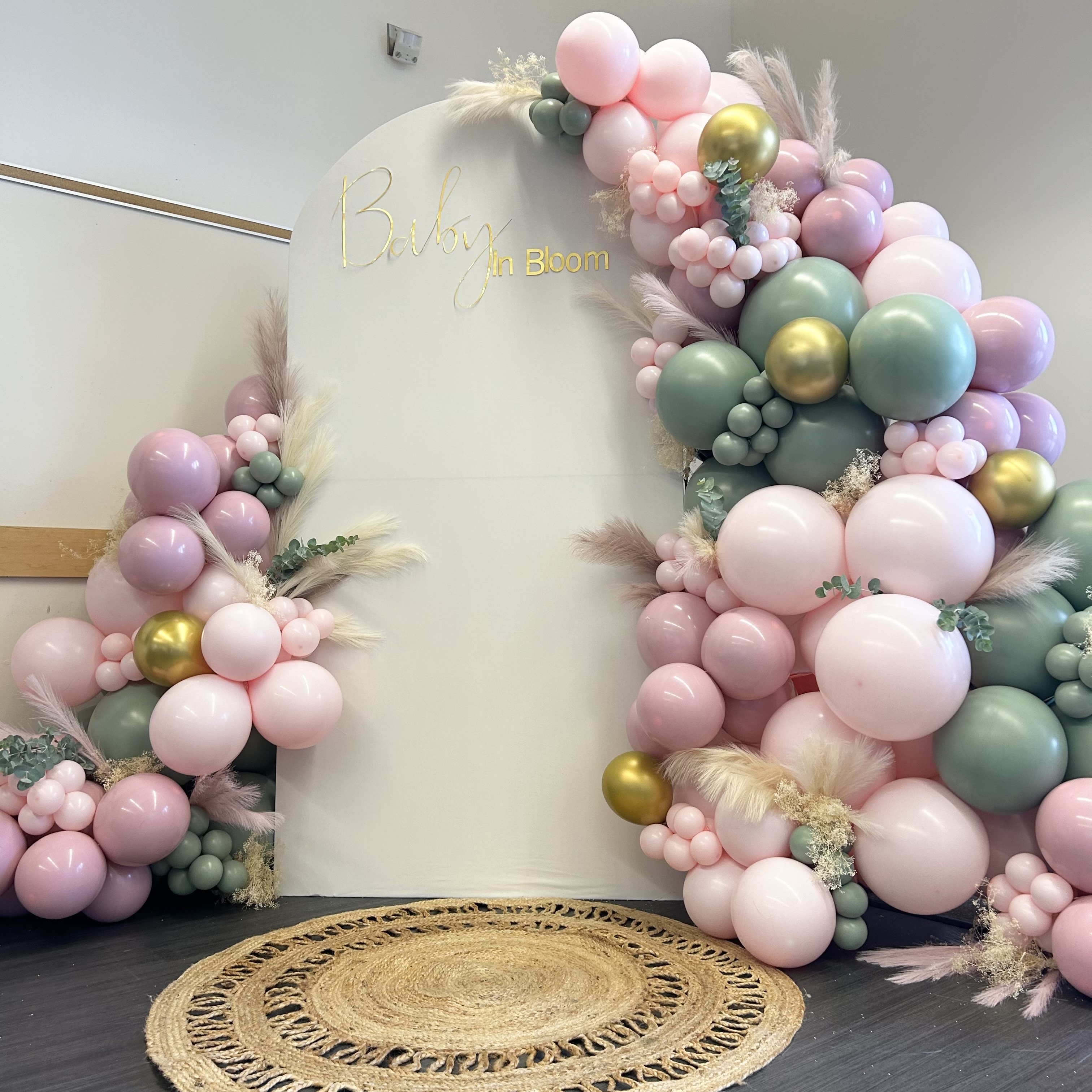 Blush, sage, and gold balloon garland and bloom backdrop for a baby shower at Rosehill Community Center in Mukilteo, WA