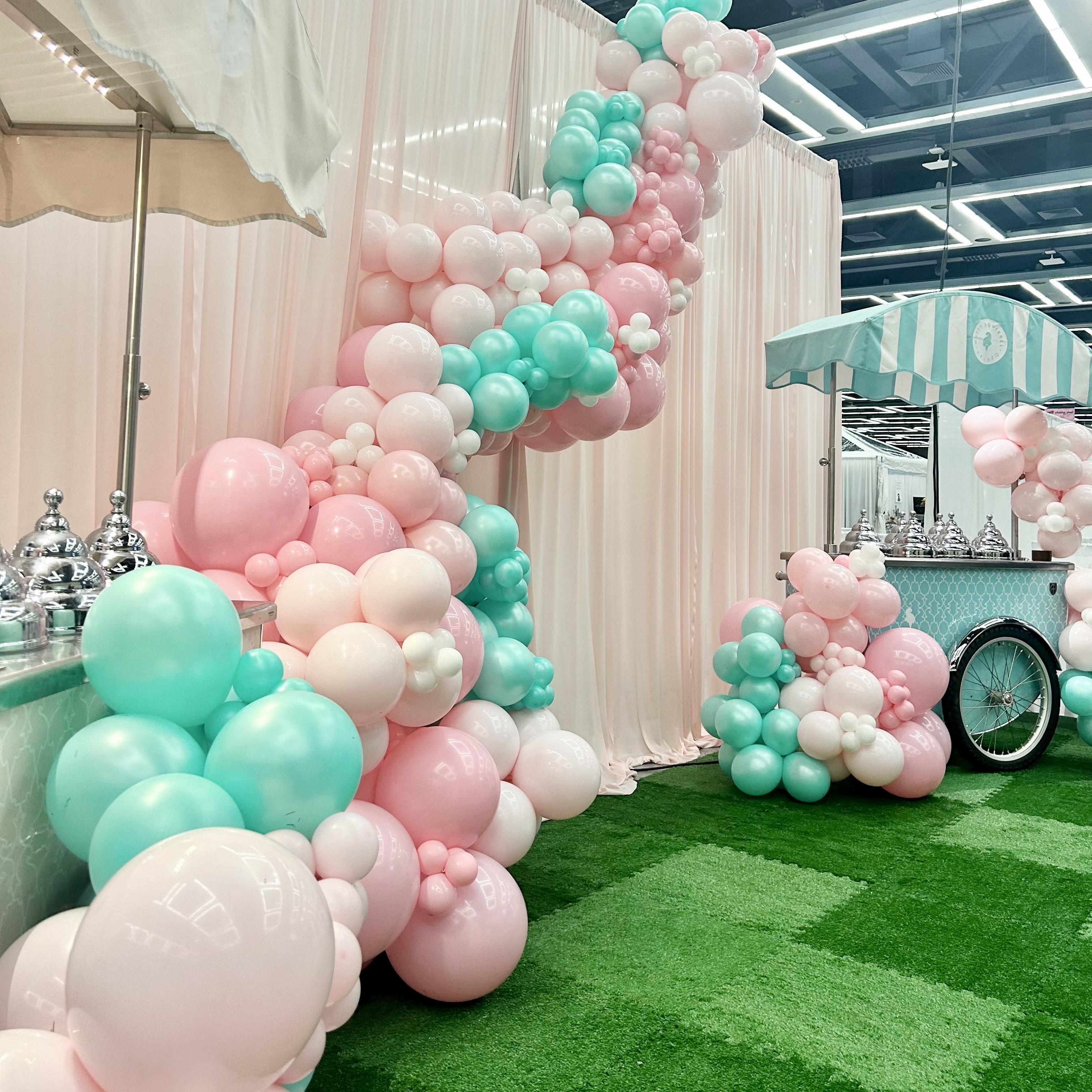Balloon garland and custom backdrop for a wedding expo at Seattle Convention Center in Seattle WA
