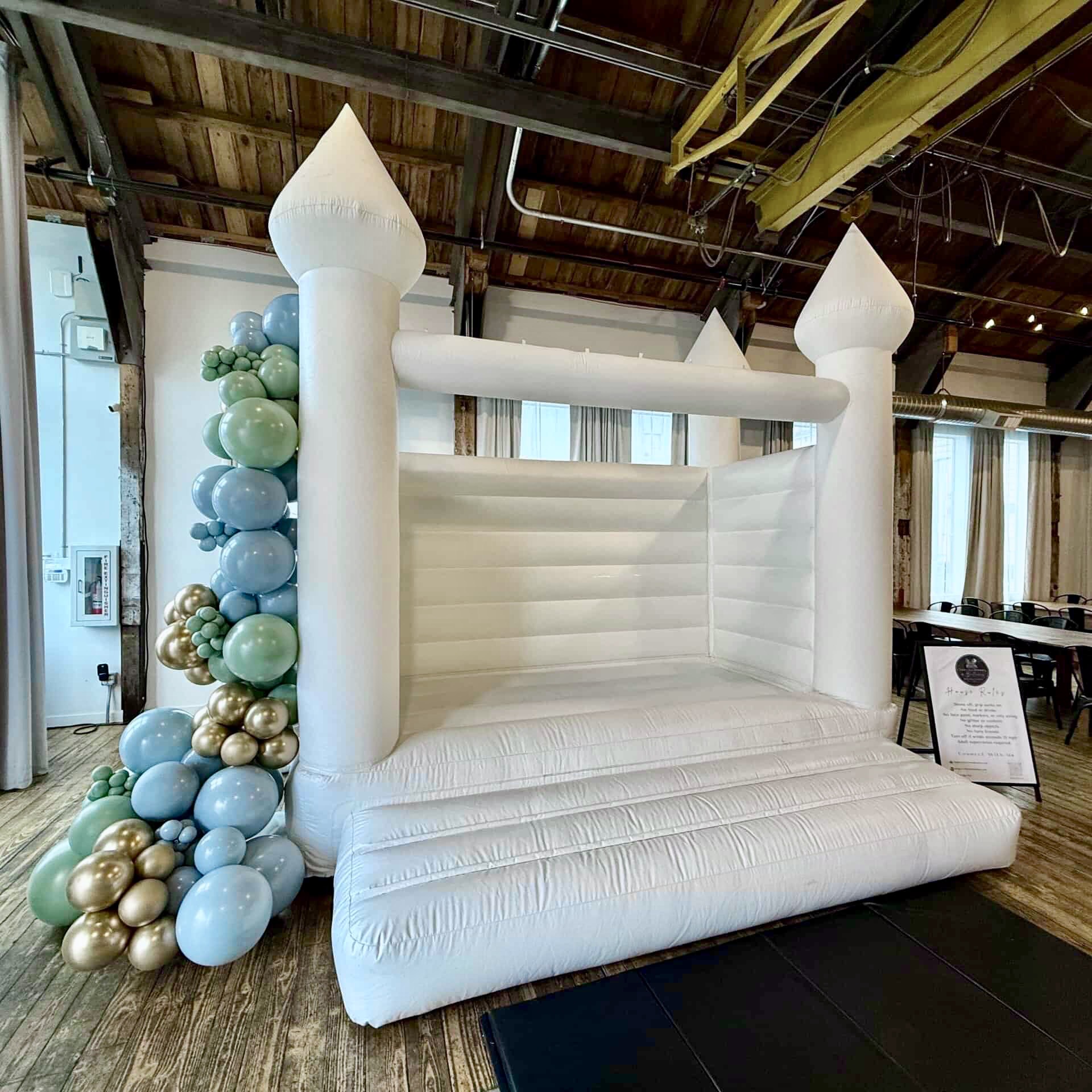 Luxury white bounce castle rental for a wedding at Metropolist in Seattle WA